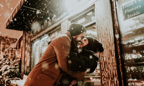 Couple kissing in snow